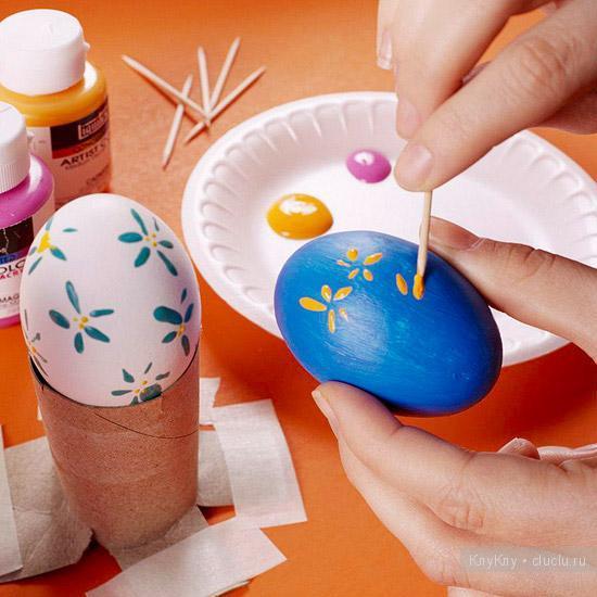painting eggs for easter 