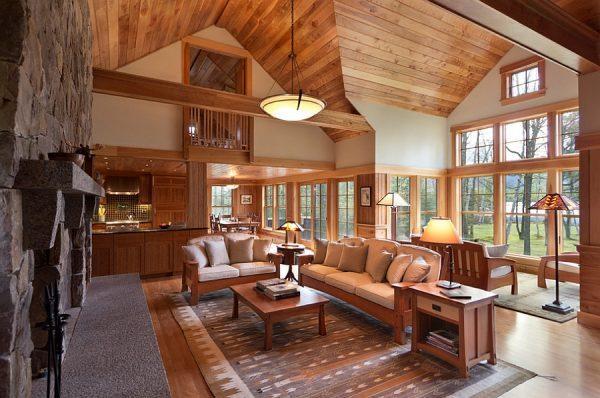 Rustic-living-room-in-wood-and-stone-with-lovely-views-outside